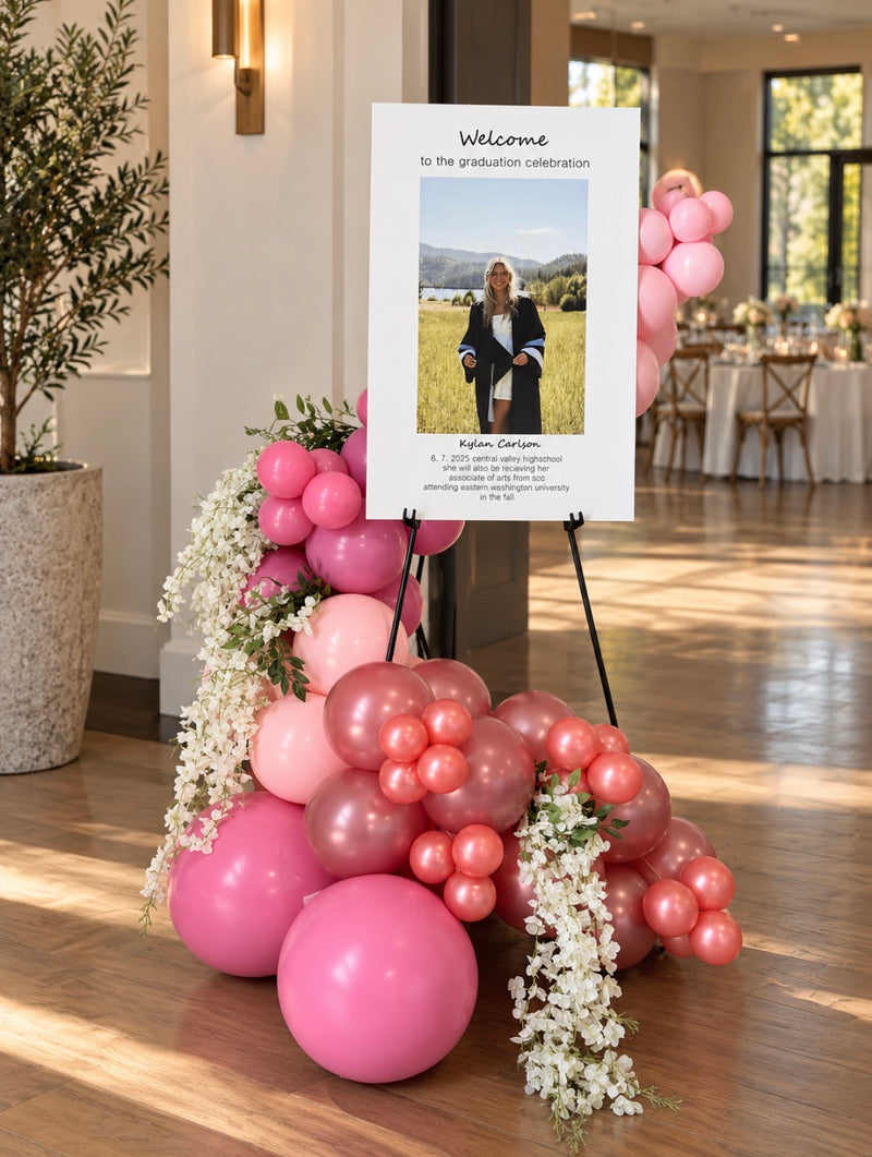Custom sign on an easel dressed with a balloon garland