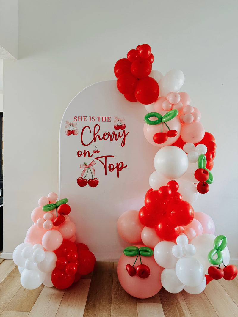 Cherry on Top printed arch panel with red and white balloon garland