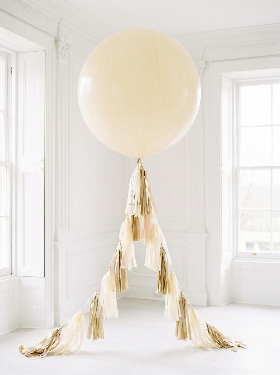 Jumbo balloon with cream and gold tassel fringe tail