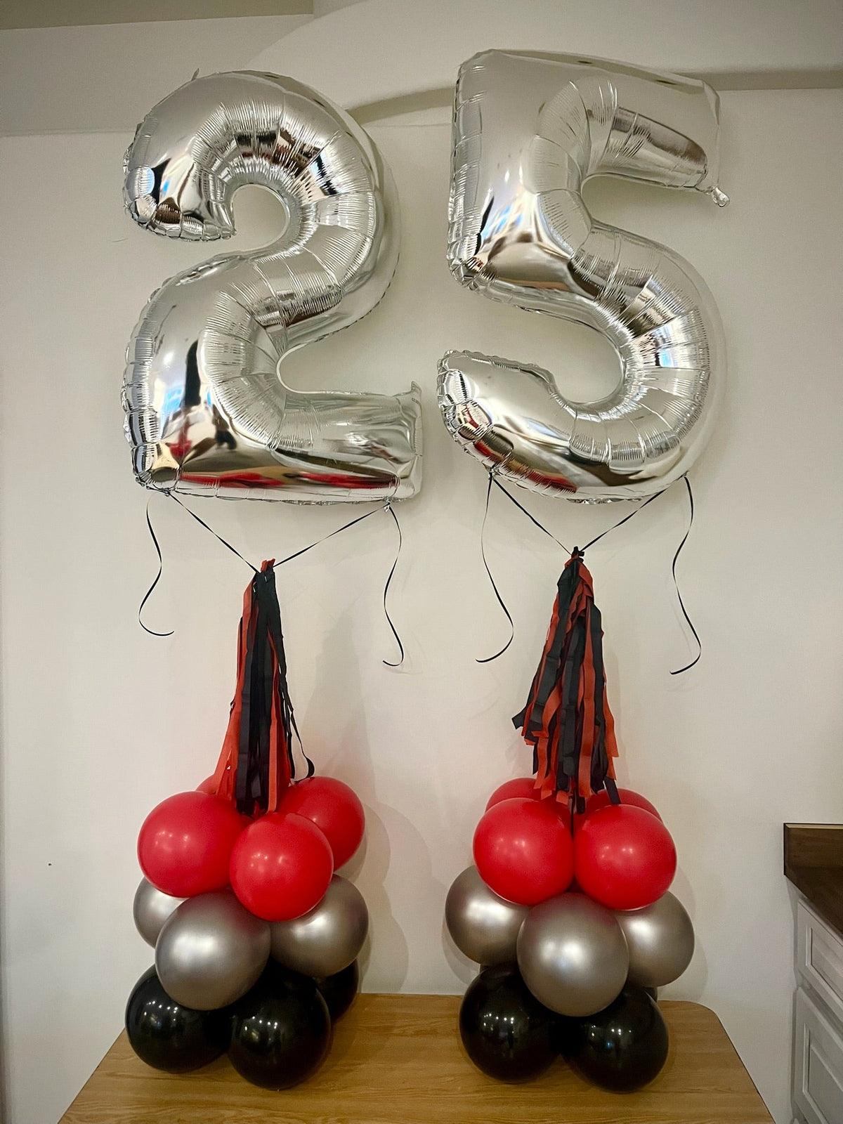 Balloon-filled number towers by Air with a Flair